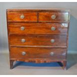 A 19th Century Straight Front Chest Of Two Short And Three Long Graduated Drawers with oval brass