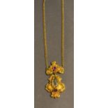 A Yellow Metal Ruby And Citrine Set Pendant Of Scroll Form with 9ct. gold linked chain, 6.7g