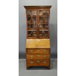 A 19th Century Mahogany Bureau Bookcase, the moulded cornice above two astragal glazed doors