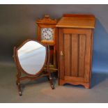 A Late Victorian Walnut Bedside Cupboard, together with a Vienna type wall clock and a shield shaped