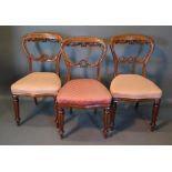 A Set Of Three Victorian Mahogany Side Chairs, each with a foliate pierced carved rail back above