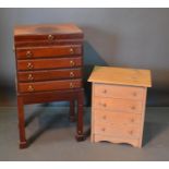 A Mahogany Canteen Cabinet On Stand, the hinged top above four drawers with brass handles, raised