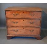 A 19th Century Mahogany Straight Front Chest Of Three Drawers with brass swan neck handles, raised