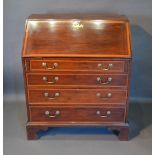 A George III Mahogany Satinwood Cross Banded Bureau, fall front enclosing a fully fitted interior