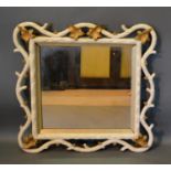 A Late 19th To Early 20th Century Carved Wooden Painted And Gilded Wall Mirror, 70cm by 70cm