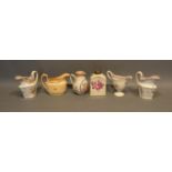 An 18th Century English Porcelain Jug, together with four other similar jugs and a tea caddy