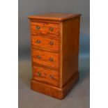 An Early 19th Century Mahogany Chest, the moulded top above four drawers with circular brass