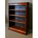 A Mahogany Dwarf Open Bookcase, the moulded top above various shelves flanked by reeded columns,