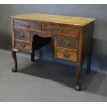 A 19th Century Mahogany Writing Desk, the moulded top above six drawers with brass handles, raised