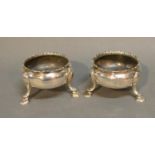 A Pair Of George III Silver Salts Of Circular Form Each With Hoof Supports