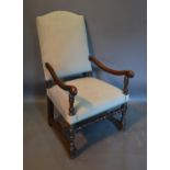 A Late 17th Or Early 18th Century Oak Open Arm chair with a high back above an over stuffed seat
