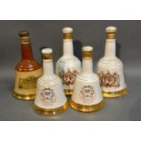 A Bells Scotch Whiskey Decanter In The Form Of A Commemorative Bell, together with four other