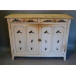 A Painted Pine Side Cabinet With Two Drawers above two cupboard doors flanked by stiles, 131cm wide,