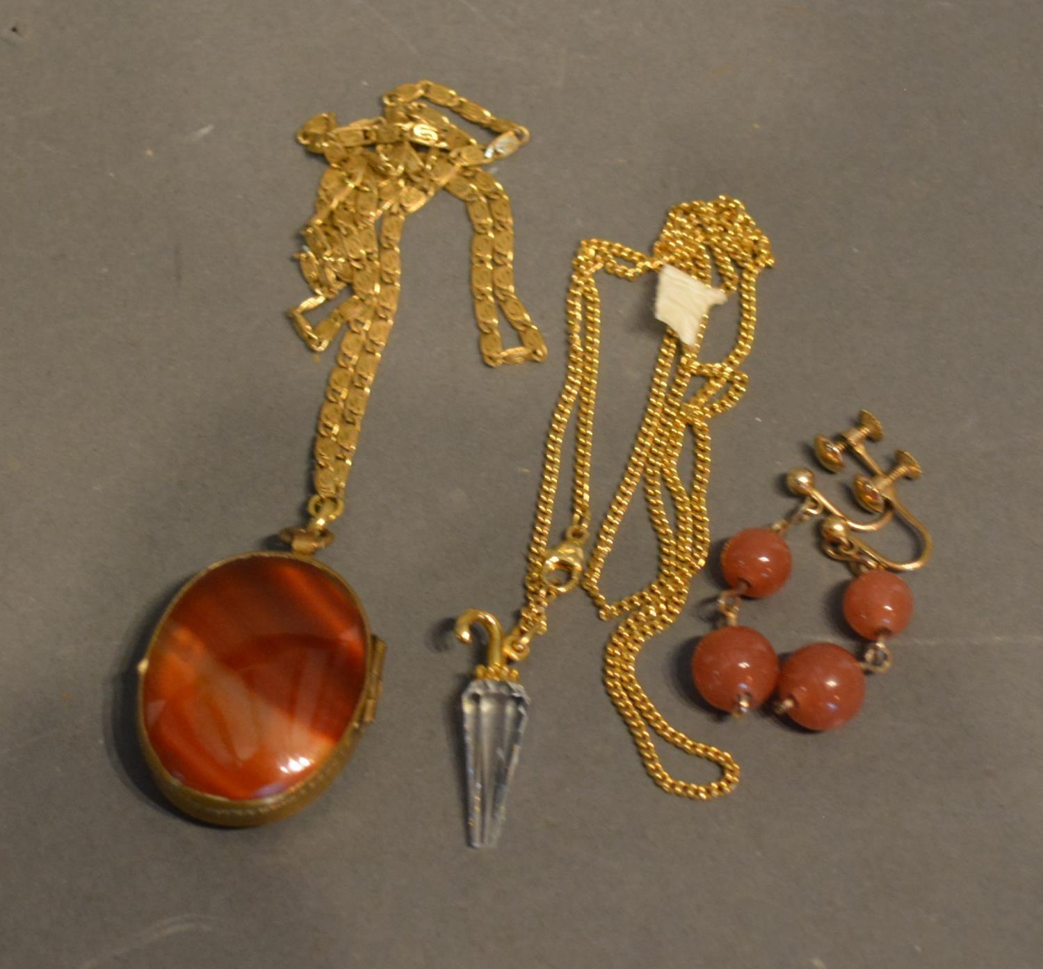 A Hard Stone Locket With Chain, Together With A Pair Of Drop Earrings and another pendant with chain