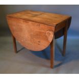 A 19th Century Mahogany Drop Flap Dining Table With Square Chamfered legs