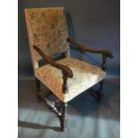 A Late 17th Early 18th Century Oak And Walnut Open Armchair with an upholstered back and seat with