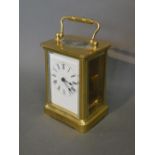A French Brass Cased Carriage Clock The Enamel Dial with Roman numerals with lever escapement and