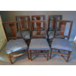 A Set Of Six Early 19th Century Dining Chairs, with pierced backs above padded seats, raised upon