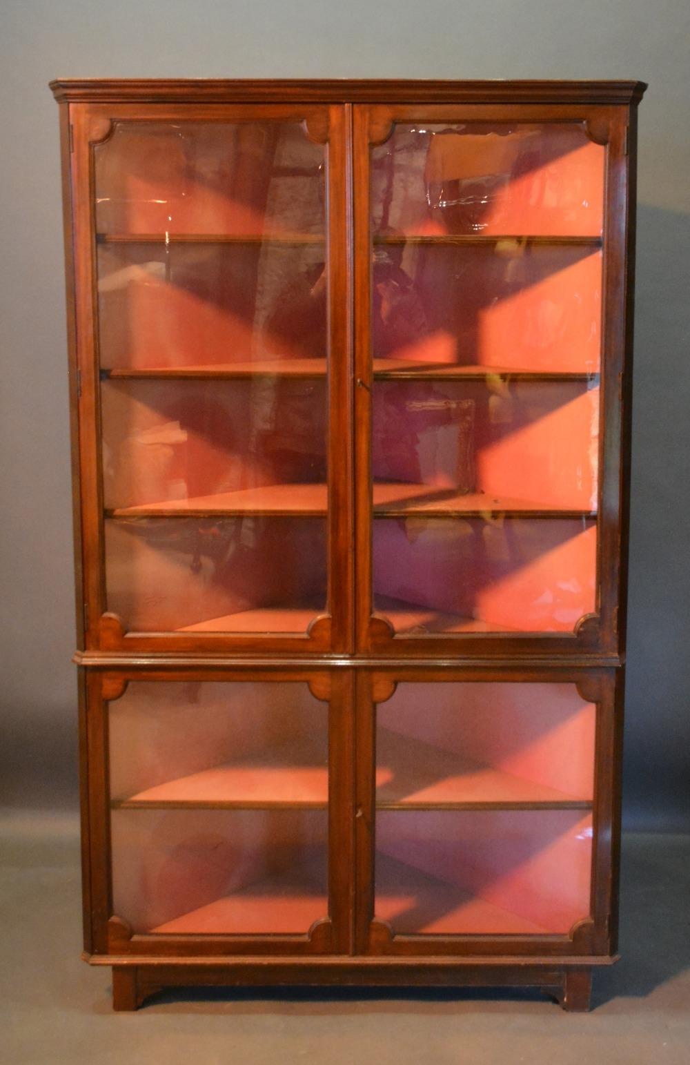 A 19th Century Mahogany Glazed Standing Corner Cabinet, with four doors enclosing shelves, raised