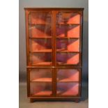 A 19th Century Mahogany Glazed Standing Corner Cabinet, with four doors enclosing shelves, raised