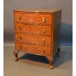 An Early 20th Century Queen Anne Walnut Style Bow Fronted Chest Of Four Drawers with brass drop