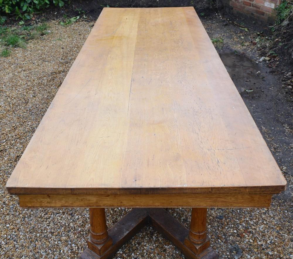 A Blonde Oak Large Refectory Style Dining Table, the plank top above a plain frieze, raised upon - Image 4 of 5
