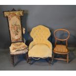 A Victorian Low Seat Chair With A Button Upholstered Back above a stuffover seat, raised upon carved