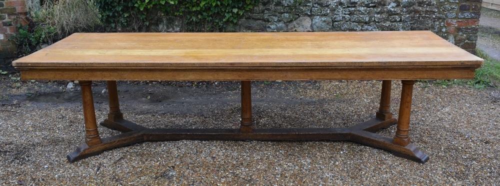 A Blonde Oak Large Refectory Style Dining Table, the plank top above a plain frieze, raised upon