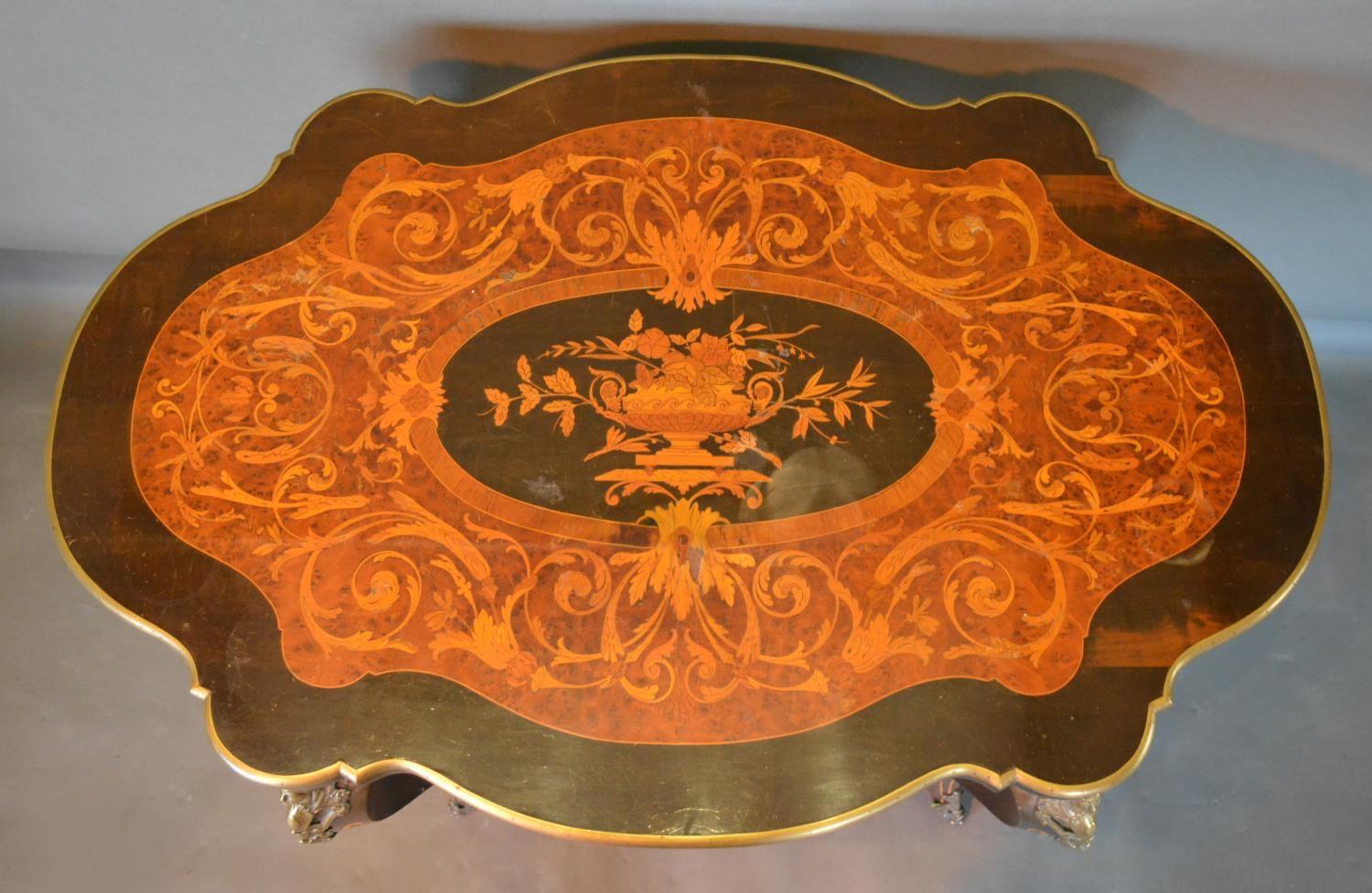 A French Marquetry Inlaid In Gilt Metal Mounted Centre Table, the shaped top above a frieze - Image 3 of 3