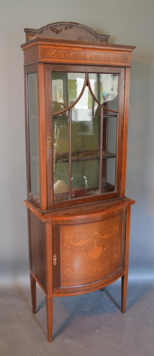 An Edwardian Mahogany And Marquetry Inlaid Display Cabinet, the shaped top above an astragal