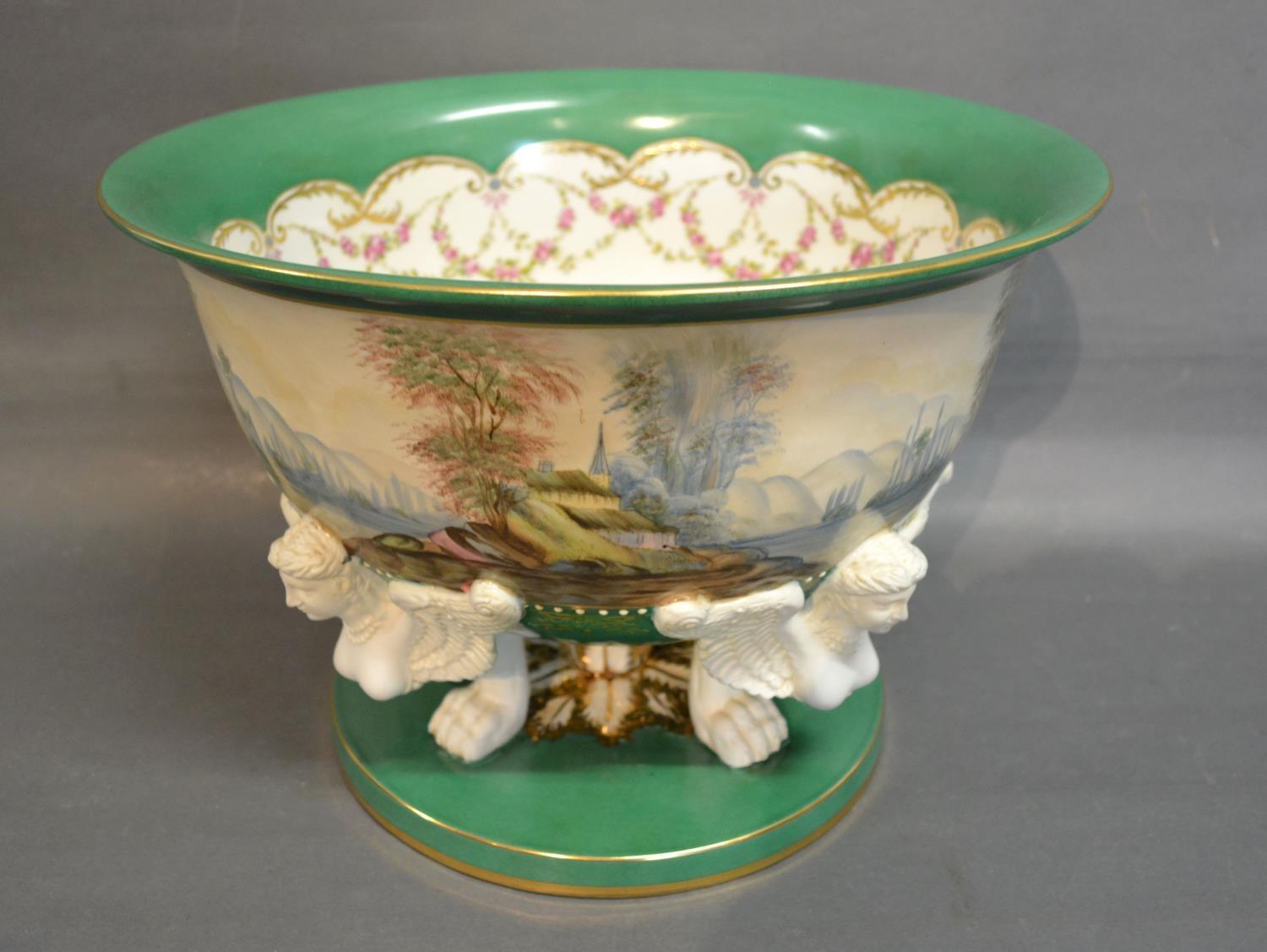 A French Sevres Style Large Pedestal Bowl hand painted with a continuous band depicting a lake