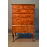 A George II Walnut Chest On Stand, the moulded top above two short and three long graduated