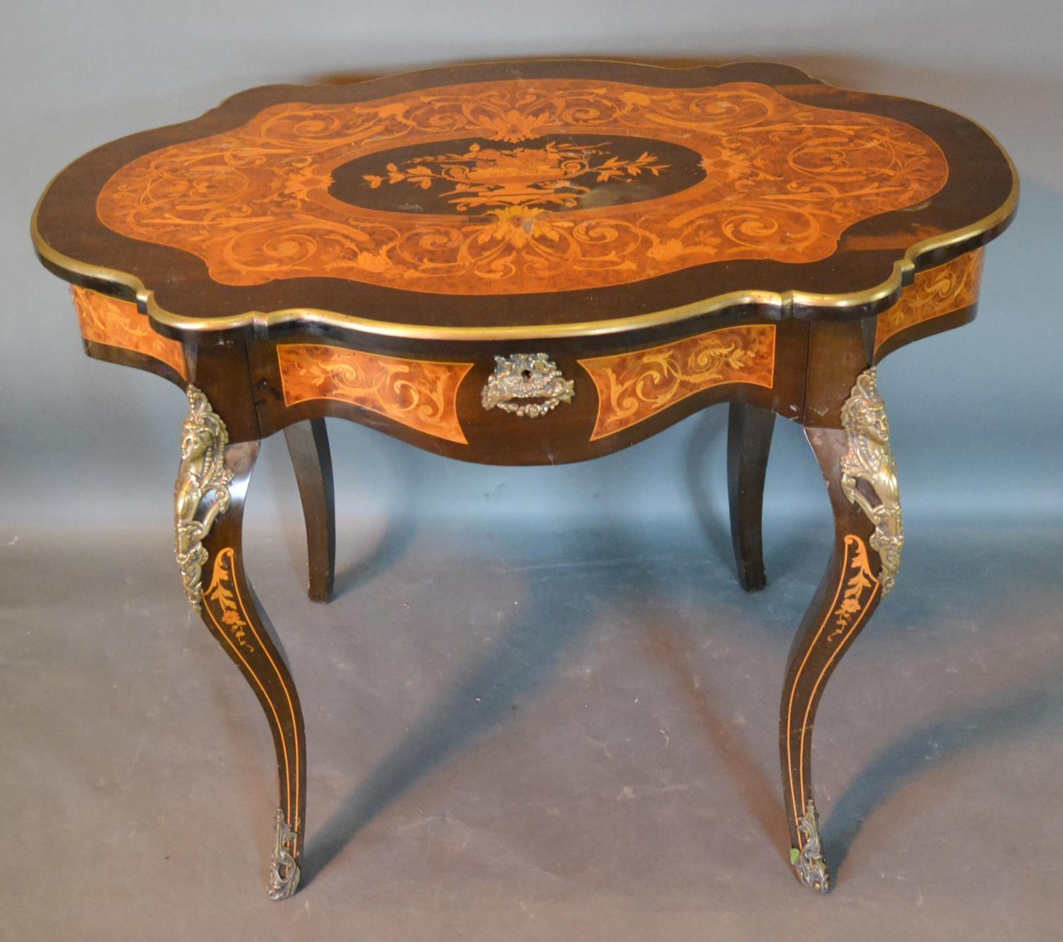 A French Marquetry Inlaid In Gilt Metal Mounted Centre Table, the shaped top above a frieze - Image 2 of 3