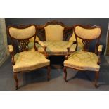 A Victorian Walnut Three Piece Drawing Room Suite, comprising sofa with two matching armchairs,