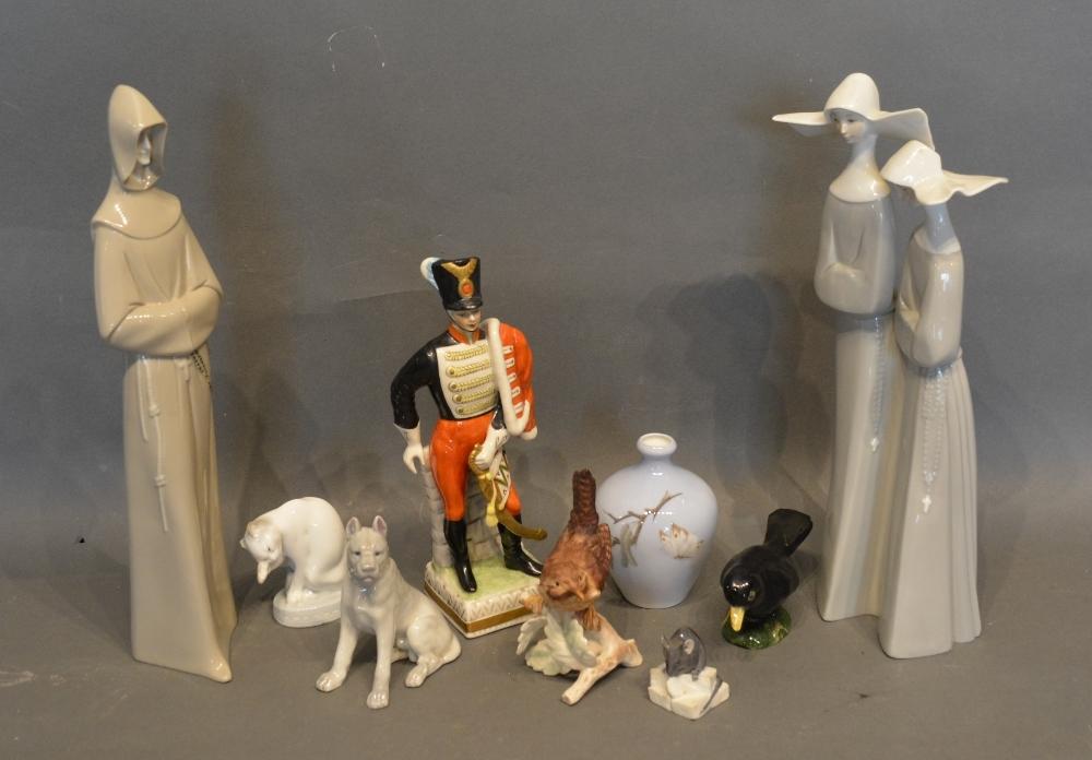 A Naples Porcelain Model Of A Hussar, together with a Lladro group of two nuns and various other