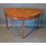 A 19th Century Mahogany Demilune Console Table, the shell inlaid and cross banded top above a