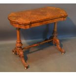 A Victorian Burr Walnut Card Table The Shaped Hinged Top above a line inlaid frieze, raised upon