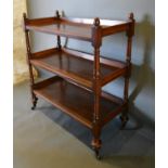 A Victorian Mahogany Buffet with a Low Galleried Back raised upon turned supports with brass caps