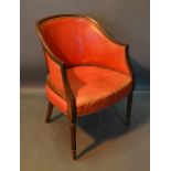 An Early 20th Century Mahogany Office Armchair with brass buttoned red leather back and seat, raised