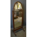 A Late 19th Early 20th Century Mahogany Cheval Mirror of Shaped Form with square tapering supports