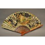 A Gauze Leaf Fan with Unusual Paper Decoupe with lacquered guards and fine decoration, 22 cms long