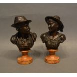 A Pair of Patinated Bronze Busts, depicting a lady and gentleman, raised upon shaped marble plinths,