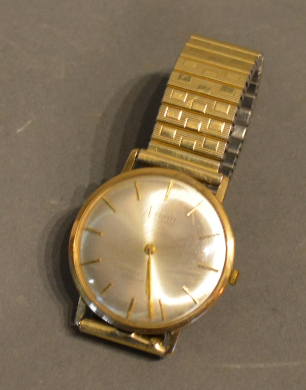 An Accurist 9ct. Gold Cased Gentleman's Wrist Watch with associated strap