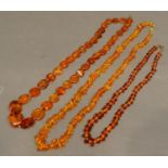 An Amber Bead Necklace, together with two other amber necklaces