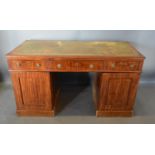 An Early 19th Century Mahogany Twin Pedestal Desk, the tooled leather inset top above three