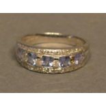 A 9ct White Gold Tanzanite and Diamond Band Ring