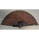 A 19th Century Tortoiseshell And Chantilly Lace Fan with red fabric backing, together with