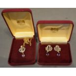 A Gold Plated Suite of Jewellery, comprising of a pendant and a pair of ear studs, set with many