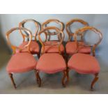 A Harlequin Set of Six Victorian Walnut Balloon Back Dining Room Chairs
