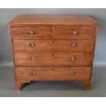 A 19th Century Mahogany Chest The Moulded Top Above Two Short and three long drawers with circular
